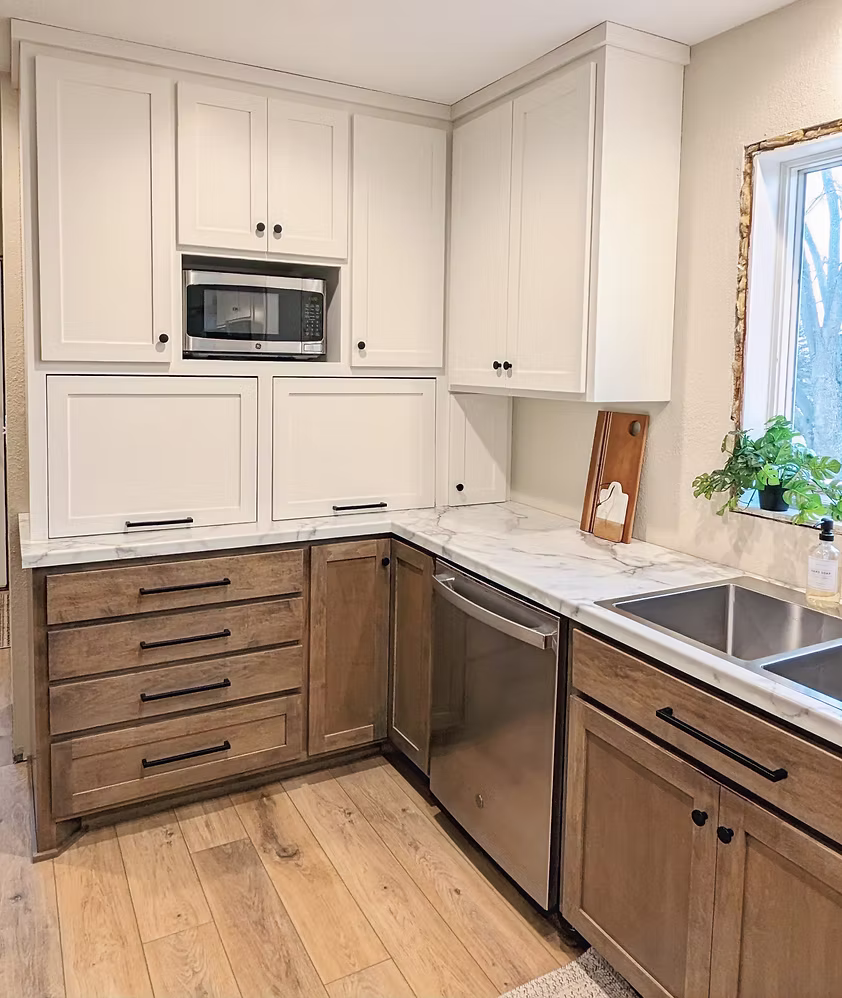 Two-tone kitchen with white upper cabinets and wood lower cabinets