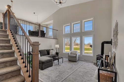 Living room — new railing system and upgraded millwork around windows — Foley, MN remodel by Simply Enhanced Homes