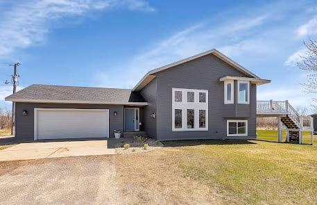 Exterior — new roof and added window wrap — Foley, MN remodel by Simply Enhanced Homes
