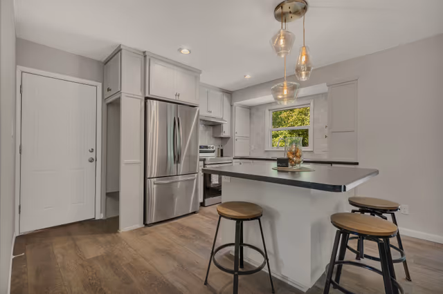 Kitchen — painted custom cabinetry with square island and drop zone — Sartell, MN remodel by Simply Enhanced Homes