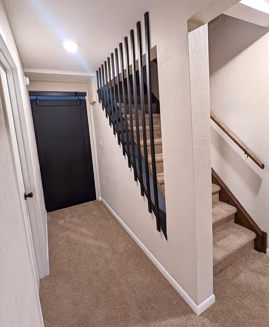 Basement — wood slat stair wall — St. Cloud, MN remodel by Simply Enhanced Homes
