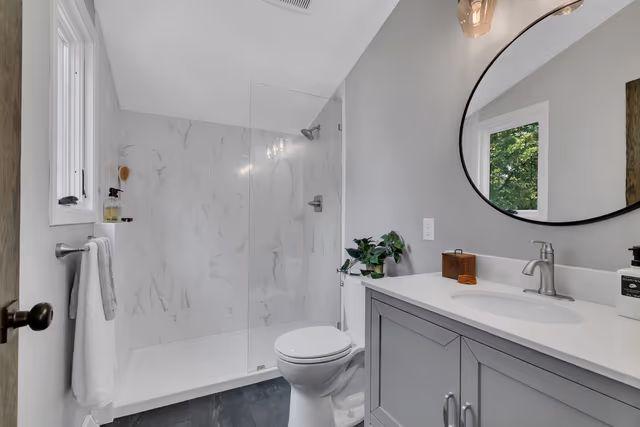 Primary bathroom — custom tiled walk-in shower — St. Cloud, MN remodel by Simply Enhanced Homes